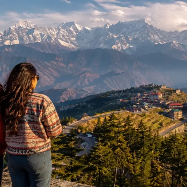 Indian travelers viewing the Himalayan mountains from a scenic Himachal Pradesh viewpoint