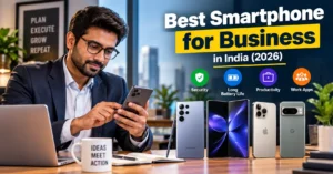 Indian professional using a smartphone while working at an office desk